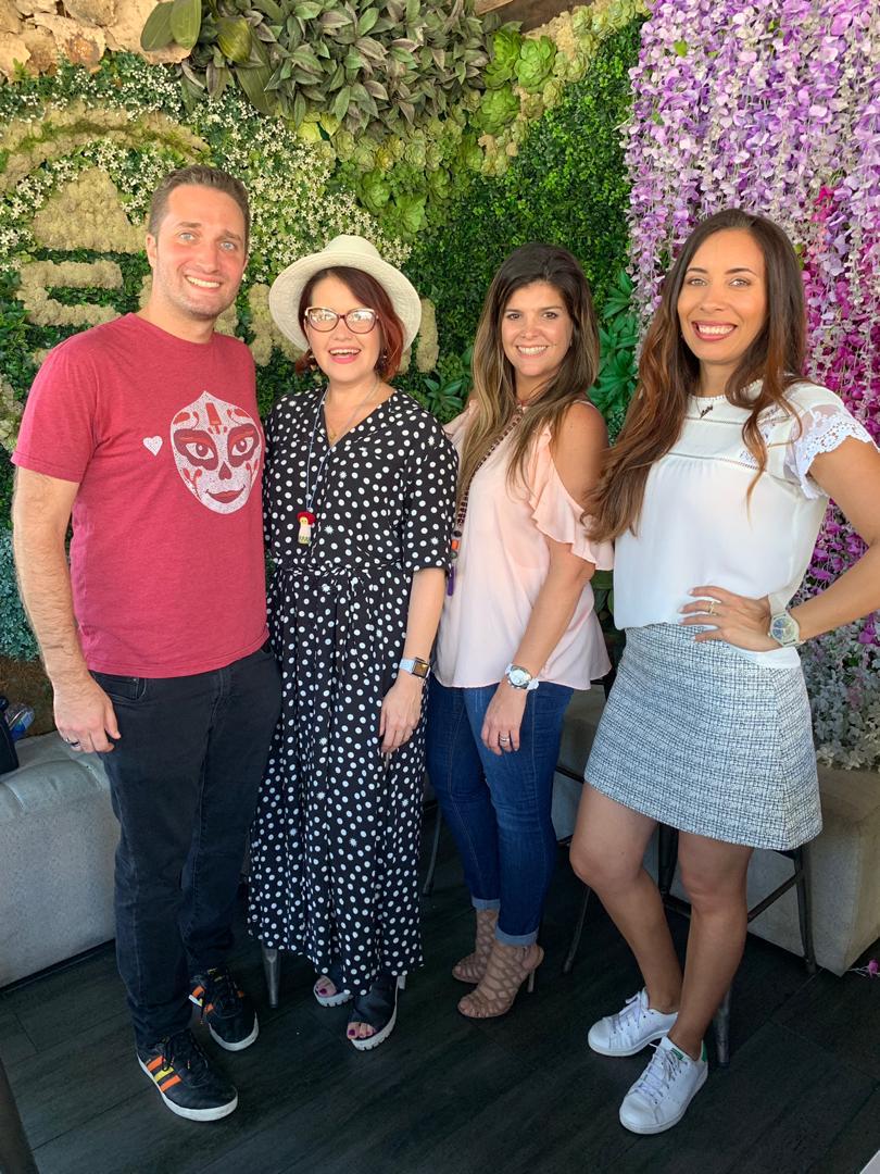 Four people pose for a photo together
